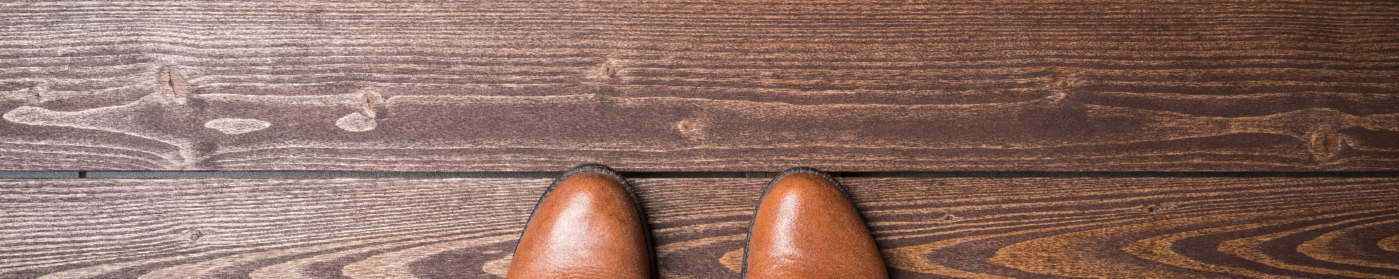 person standing on hardwood floor